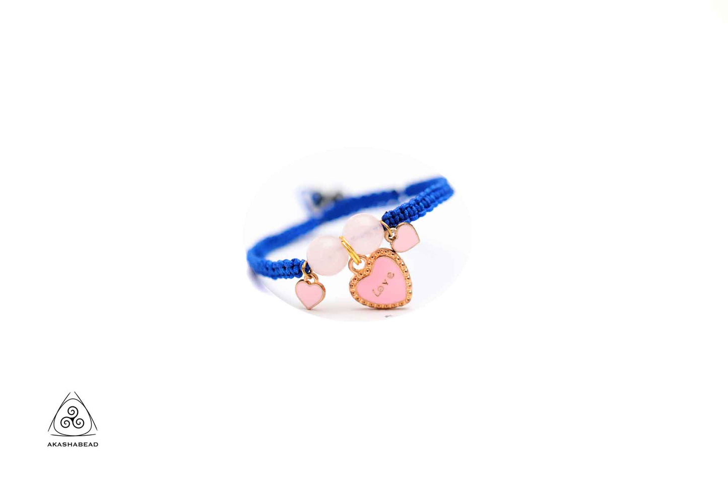 Braided bracelet with pink heart charm and love charm