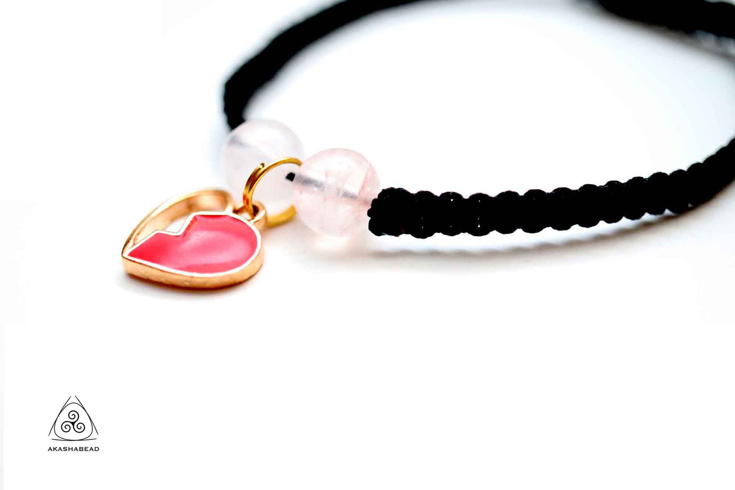 Adjustable Black Braided bracelet with heart charm and two rose quartz natural stone