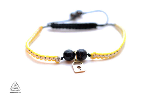 Braided yellow-white with gold color lock charm and sparkly onyx stone  | 8mm